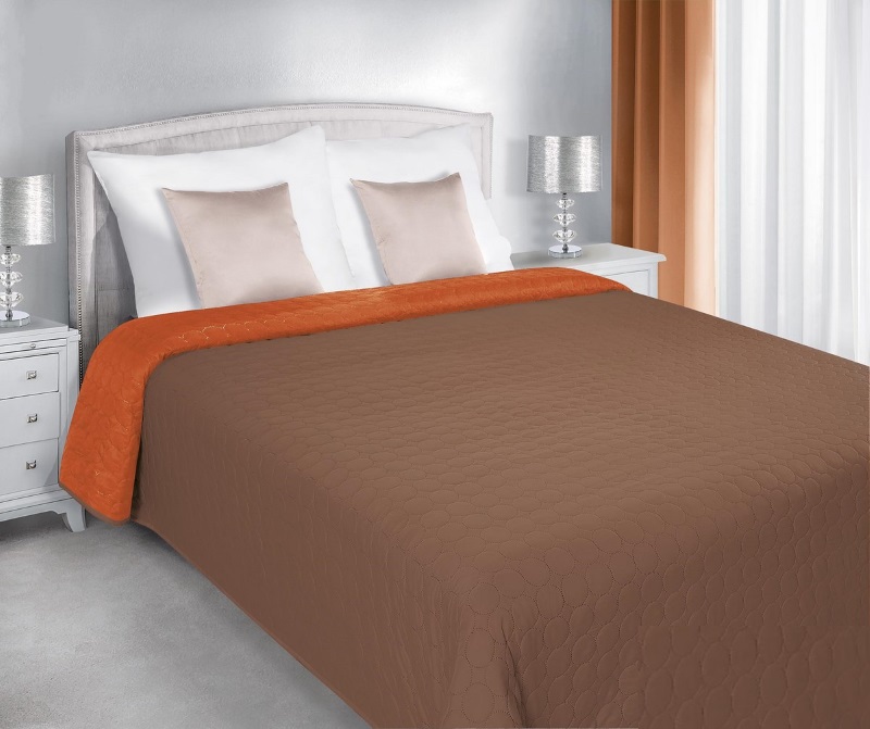 Brązowo pomarańczowa dwustronna narzuta na łóżko