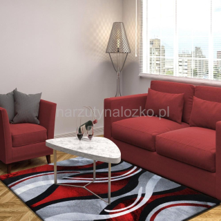 Szary dywan w czerwone wzory do sypialni